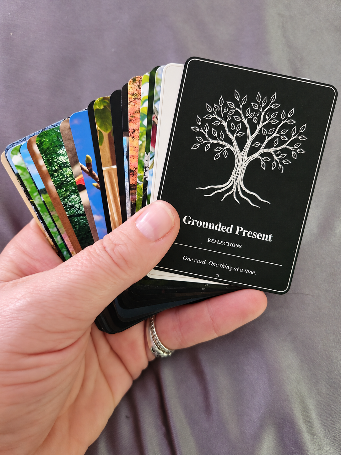 The first printed prototype of the Grounded Present Reflections card deck, fanned out
